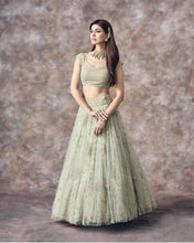 Wedding Wear Aqua Green Color Net Lehenga For Bride