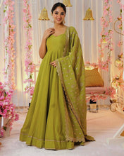 Wedding Wear Green Color Heavy Chinnon Silk Gown For Girls